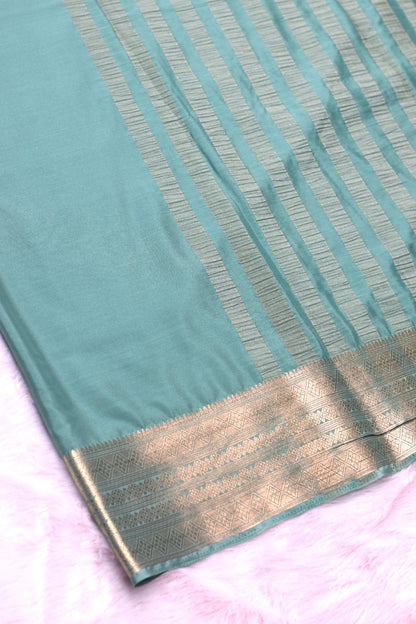 Teal Green Viscose Georgette Saree with Gold Zari Border &Attached Blouse Piece