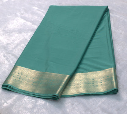 Teal Green Viscose Georgette Saree with Gold Zari Border &Attached Blouse Piece