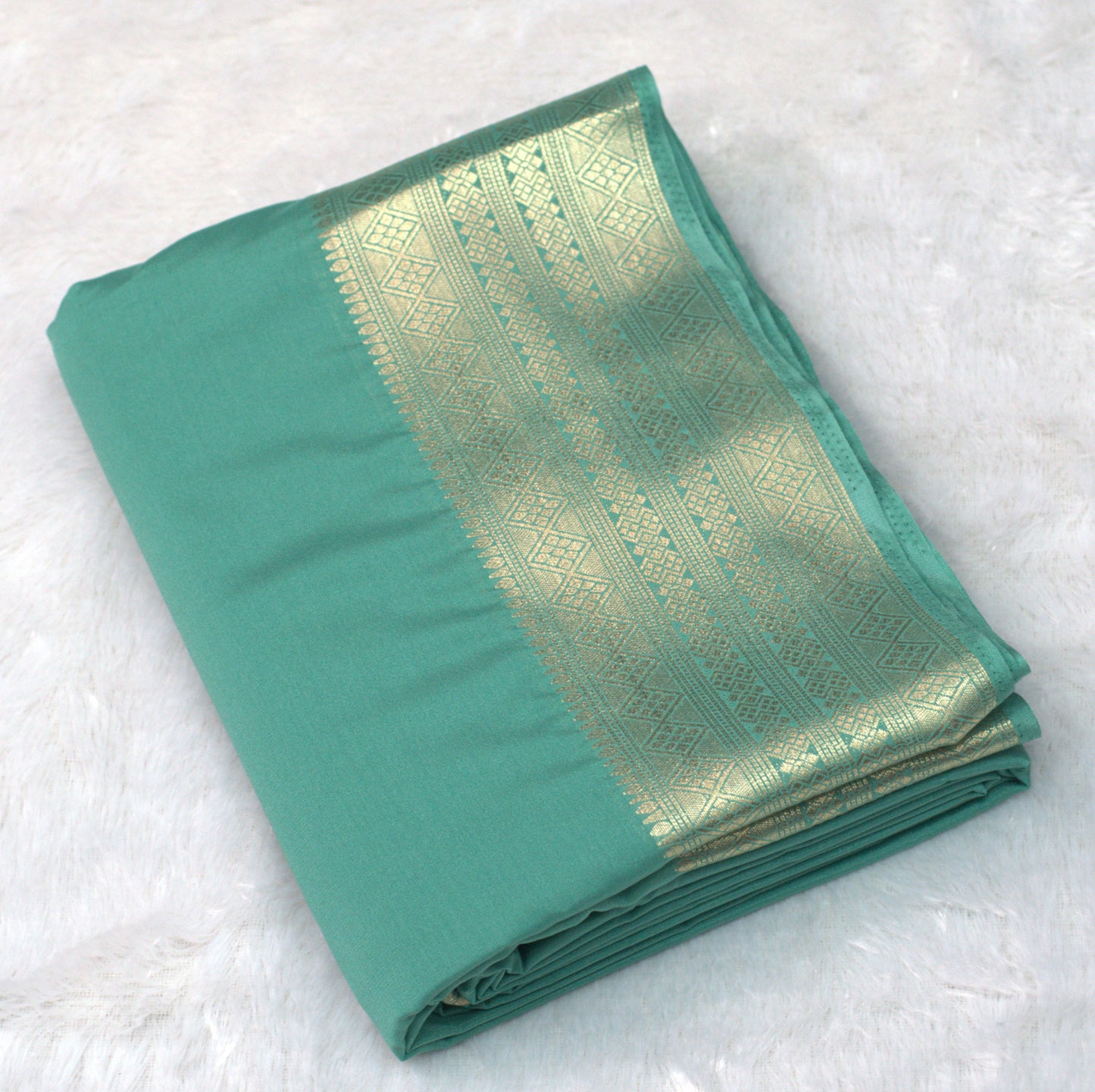 Teal Green Viscose Georgette Saree with Gold Zari Border &Attached Blouse Piece