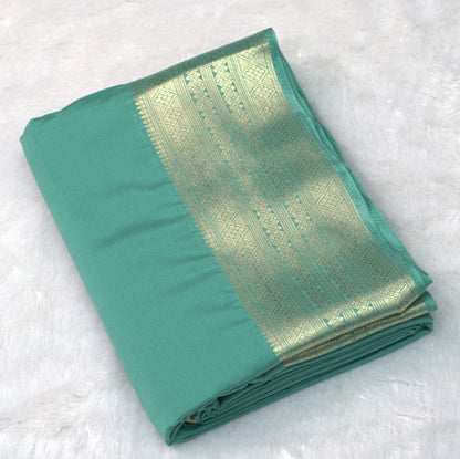 Teal Green Viscose Georgette Saree with Gold Zari Border &Attached Blouse Piece